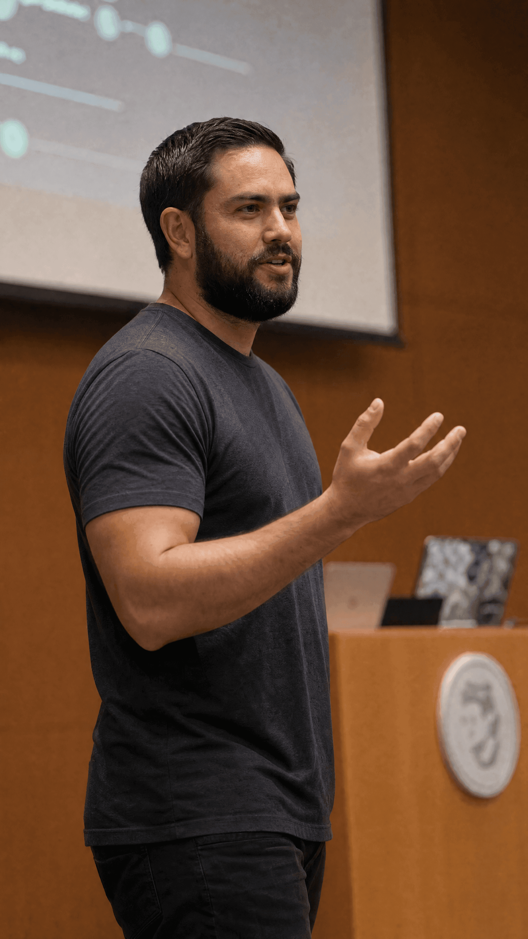 Jordan speaking and gesturing during a RubyHack presentation